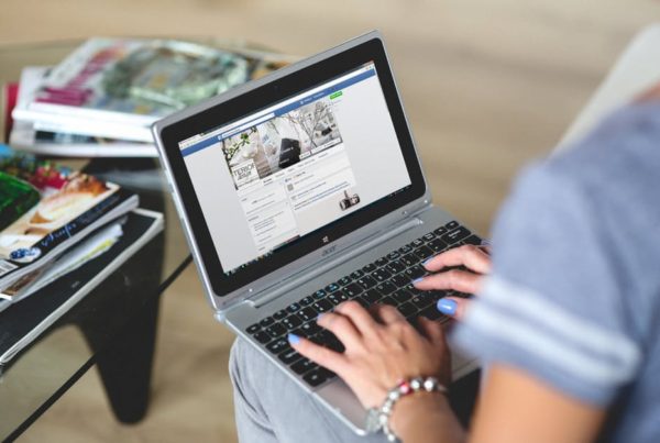 laptop showing facebook reach in marketing for accountants